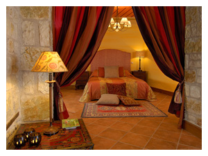 Romantic bedroom with red drapes